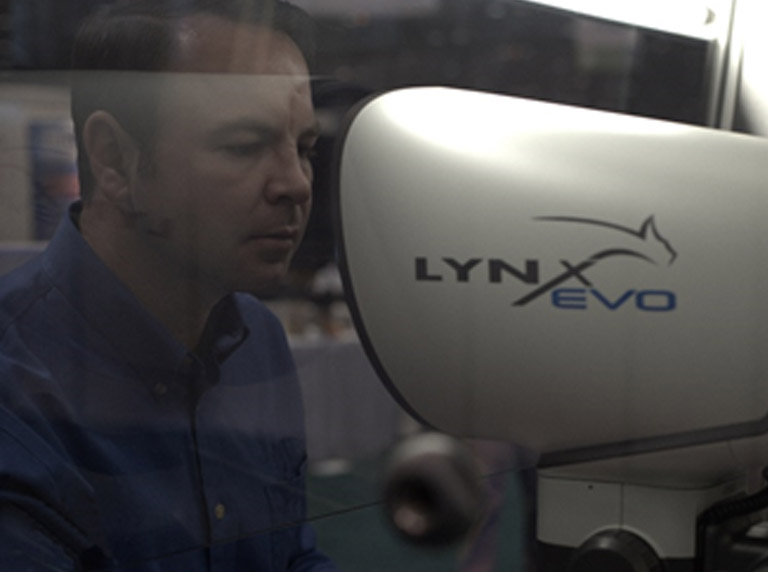 Lynx EVO microscope inside laminar flow cabinet with user