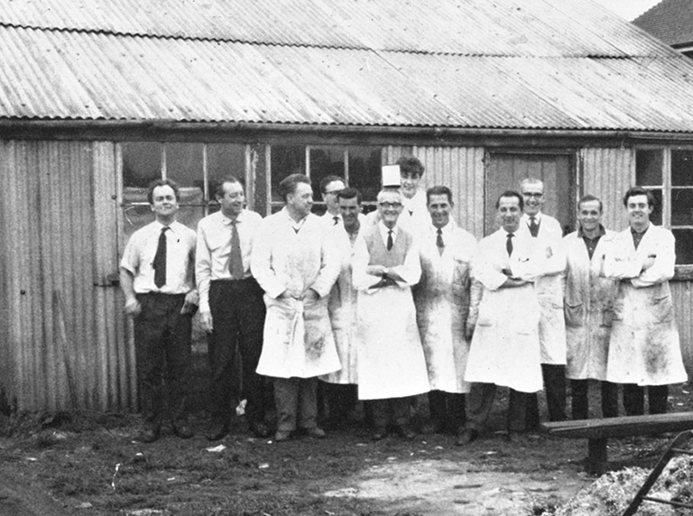 Fist Vision Engineering employees in 1958 outside the workshop