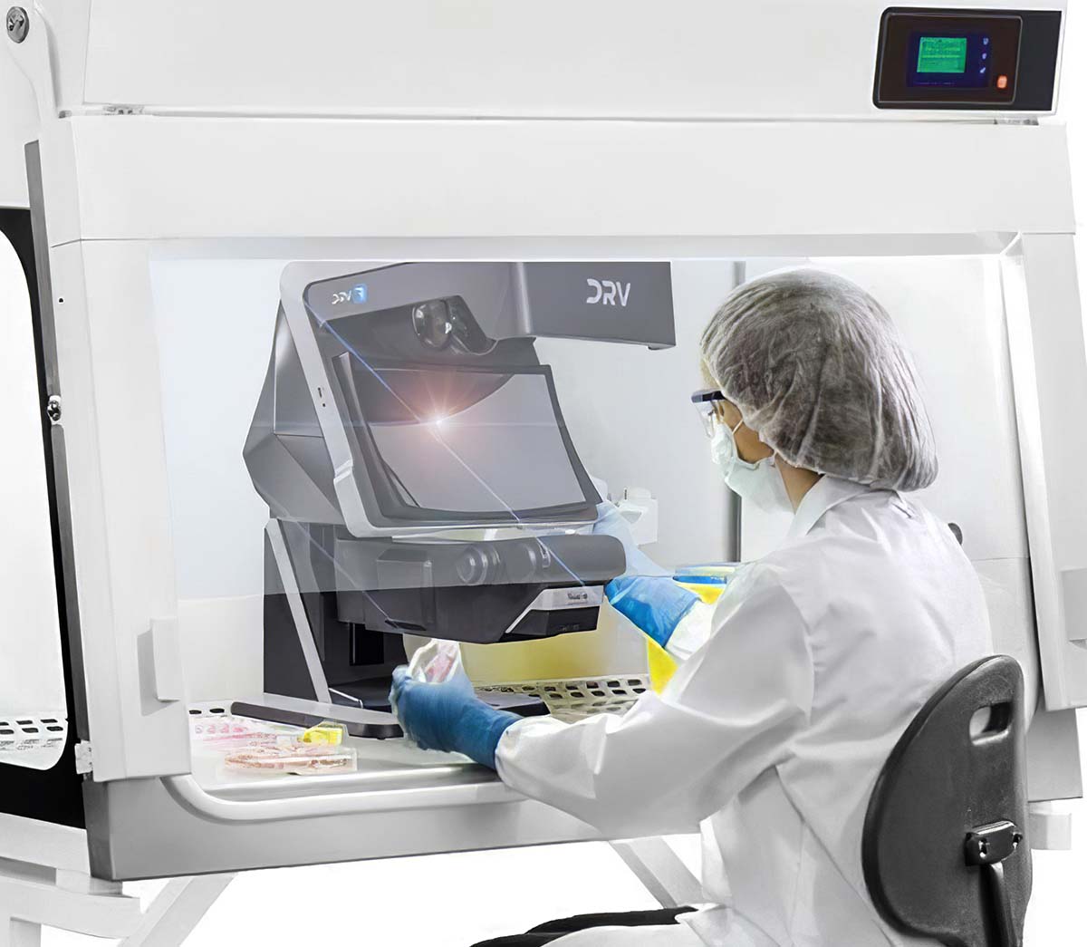 DRV-Z1-biomed-application-product-finder-1200x1045px DRV-Z1 3D viewer being using in laminar flow cabinet by operator in white coat, mask and safety glasses