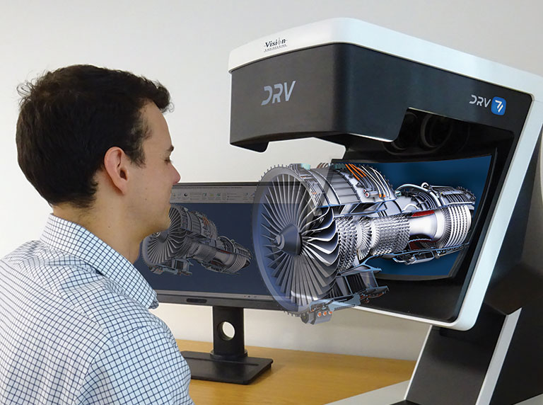 DRV-viewer-with-engine-768×572 Man looking through DRV viewer inspecting engine in 3D