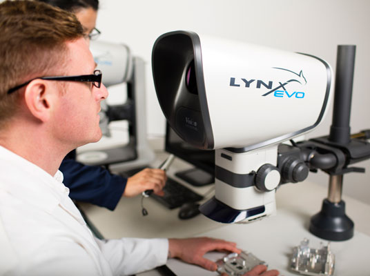 Lynx-EVO-innovation-1604-vision-318-536×400-1 Manager showing a operator the Mantis Stereo Microscope on universal stand
