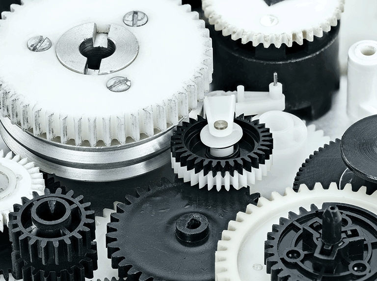 application-micro-mechanics-768×572 Close up of plastic cogs in a mechanism