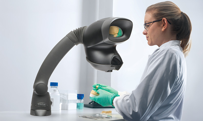 OPTA_Dental_1-800-480 A dental technician using OPTA to inspect a teeth moulding